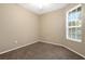 Bright bedroom featuring carpet floors, window with blinds and ceiling fan at 417 Enclave Pl # 2, Lakeland, FL 33803