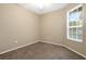 Bedroom showcasing a large window with natural light and a neutral color scheme at 417 Enclave Pl # 2, Lakeland, FL 33803