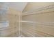 Walk-in closet with multiple white wire shelves on three sides and carpet floor at 417 Enclave Pl # 2, Lakeland, FL 33803