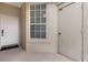 Inviting entrance featuring a white door, window with blinds, and unit number for easy identification at 417 Enclave Pl # 2, Lakeland, FL 33803