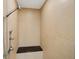 Shower stall with a shower head, control handles, and a black granite bench at 417 Enclave Pl # 2, Lakeland, FL 33803