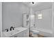 Bright bathroom features stylish fixtures, vanity and a shower-tub combo at 4601 Sw Reynosa Sw Dr, Winter Haven, FL 33880