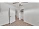 Bright bedroom with wood-look floors features a ceiling fan, closet and an open doorway at 4601 Sw Reynosa Sw Dr, Winter Haven, FL 33880