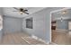 Neutral bonus room with tiled floors, a ceiling fan, and an adjacent kitchen at 4601 Sw Reynosa Sw Dr, Winter Haven, FL 33880