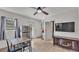 Bright kitchen features a stainless steel refrigerator, table, and a view into the bathroom at 4601 Sw Reynosa Sw Dr, Winter Haven, FL 33880