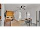 Cozy living room with wood paneled accent wall, ceiling fan, and sleek wood-look floors at 4601 Sw Reynosa Sw Dr, Winter Haven, FL 33880