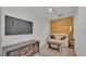 Comfortable living room features a wood paneled accent wall and modern wood-look floors at 4601 Sw Reynosa Sw Dr, Winter Haven, FL 33880