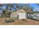 Image of a backyard shed with a roll-up garage door at 4601 Sw Reynosa Sw Dr, Winter Haven, FL 33880