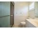 Well-lit bathroom with a glass door shower and modern fixtures at 474 Cameo Dr, Lakeland, FL 33803