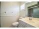 Neutral bathroom with single sink vanity and a step-in shower at 474 Cameo Dr, Lakeland, FL 33803