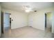 Bedroom featuring tile flooring, ceiling fan, and two entrances to other rooms at 474 Cameo Dr, Lakeland, FL 33803