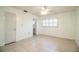 Bedroom with neutral walls, tile flooring, and view to ensuite bathroom at 474 Cameo Dr, Lakeland, FL 33803