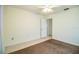 Bedroom featuring tile flooring, an open doorway, and ceiling fan with lights at 474 Cameo Dr, Lakeland, FL 33803