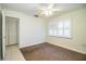 Bedroom featuring carpet, window with shutters, and closet at 474 Cameo Dr, Lakeland, FL 33803