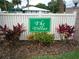 Close up of the Community sign with vibrant flower bed at 474 Cameo Dr, Lakeland, FL 33803