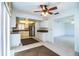 View of the bright kitchen featuring stainless steel appliances and white cabinets, open to living area at 474 Cameo Dr, Lakeland, FL 33803