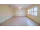 Bright living room with tile flooring, neutral walls, and shuttered window at 474 Cameo Dr, Lakeland, FL 33803