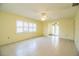 Inviting living room with neutral walls, tiled floors, and shutters at 474 Cameo Dr, Lakeland, FL 33803