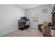 Bedroom featuring a desk, a chair, and a window with natural light at 5002 Rain Shadow Dr, St Cloud, FL 34772