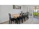 Cozy dining room featuring a rustic wood table, black chairs, and serene decor at 5002 Rain Shadow Dr, St Cloud, FL 34772