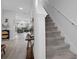 Bright hallway with a staircase leading to the upper level of the home at 5002 Rain Shadow Dr, St Cloud, FL 34772