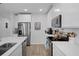 Modern kitchen with white cabinets, stainless steel appliances, and a subway tile backsplash at 5002 Rain Shadow Dr, St Cloud, FL 34772