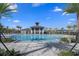 Community pool with sundeck, splash pad, and shaded seating, perfect for relaxation and Gathering fun at 5002 Rain Shadow Dr, St Cloud, FL 34772