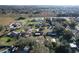 Overhead photo displays the neighborhood, revealing a tranquil setting amid lush greenery and nearby amenities at 5121 Idlewood Ln, Lakeland, FL 33811