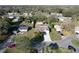 Bird's-eye view presents the property in its residential area, accented by established trees and landscaping at 5121 Idlewood Ln, Lakeland, FL 33811