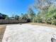 Full-size outdoor basketball court for recreational activities and sports, bordered by a wooden fence at 5121 Idlewood Ln, Lakeland, FL 33811