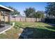 Spacious backyard with a wooden fence, offering privacy and room for recreation or gardening at 526 Hampton Ave, Lakeland, FL 33801