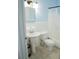 Bright bathroom featuring a pedestal sink, tiled shower, and white fixtures at 526 Hampton Ave, Lakeland, FL 33801