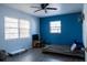 Bedroom with stylish wood-look floors, large window and contemporary ceiling fan at 526 Hampton Ave, Lakeland, FL 33801