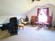 Cozy attic features carpet and chairs, offering a versatile space for relaxation or hobbies at 5626 Sawyer Rd, Lakeland, FL 33810