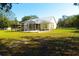 Backyard with a screened patio and covered patio at 5626 Sawyer Rd, Lakeland, FL 33810