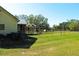 Large backyard featuring a fenced yard with a covered structure at 5626 Sawyer Rd, Lakeland, FL 33810