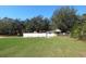 Large backyard with fenced yard and a small shed at 5626 Sawyer Rd, Lakeland, FL 33810