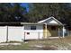 View of fenced-in building exterior at 5626 Sawyer Rd, Lakeland, FL 33810