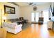 Bright living room featuring hardwood floors, a ceiling fan, and stylish furniture at 5626 Sawyer Rd, Lakeland, FL 33810