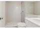 Bathroom featuring gray tiled shower and stone vanity with bright natural light at 5908 Lunn Rd, Lakeland, FL 33811