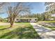 Charming single-story home with stone accents, a well-maintained lawn, and inviting curb appeal at 5908 Lunn Rd, Lakeland, FL 33811