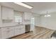 Newly remodeled kitchen with stainless steel appliances, white cabinets, and a subway tile backsplash at 5908 Lunn Rd, Lakeland, FL 33811