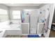 Bathroom featuring a tiled shower, soaking tub, and a window for natural light at 5942 White Tail Loop, Lakeland, FL 33811