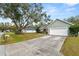 Home exterior displaying a driveway, attached garage, and green front yard at 5942 White Tail Loop, Lakeland, FL 33811