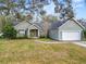 Charming single-story home with manicured lawn and attached garage at 5942 White Tail Loop, Lakeland, FL 33811