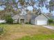 Charming single-story home with manicured lawn and attached garage at 5942 White Tail Loop, Lakeland, FL 33811