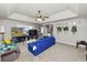 Bright and airy living room with a tray ceiling, neutral paint, and large windows at 5942 White Tail Loop, Lakeland, FL 33811