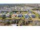 Aerial view highlighting waterfront homes with pools in a lush, well-established neighborhood at 6018 Abbey Oaks Dr, Lakeland, FL 33811