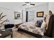 Comfortable bedroom featuring carpet, ceiling fan, a window, closet, and decor mirror at 6018 Abbey Oaks Dr, Lakeland, FL 33811