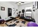 Bright exercise room with treadmill, bike, and natural light from a window at 6018 Abbey Oaks Dr, Lakeland, FL 33811